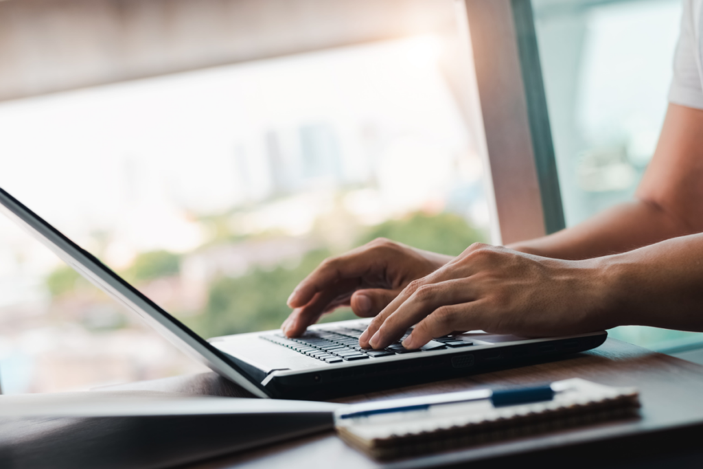 Person completing an online administrative procedure on a laptop